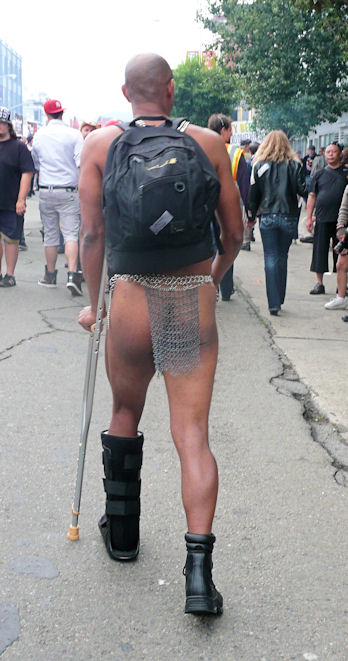 man with broken leg and metal mesh loin cloth